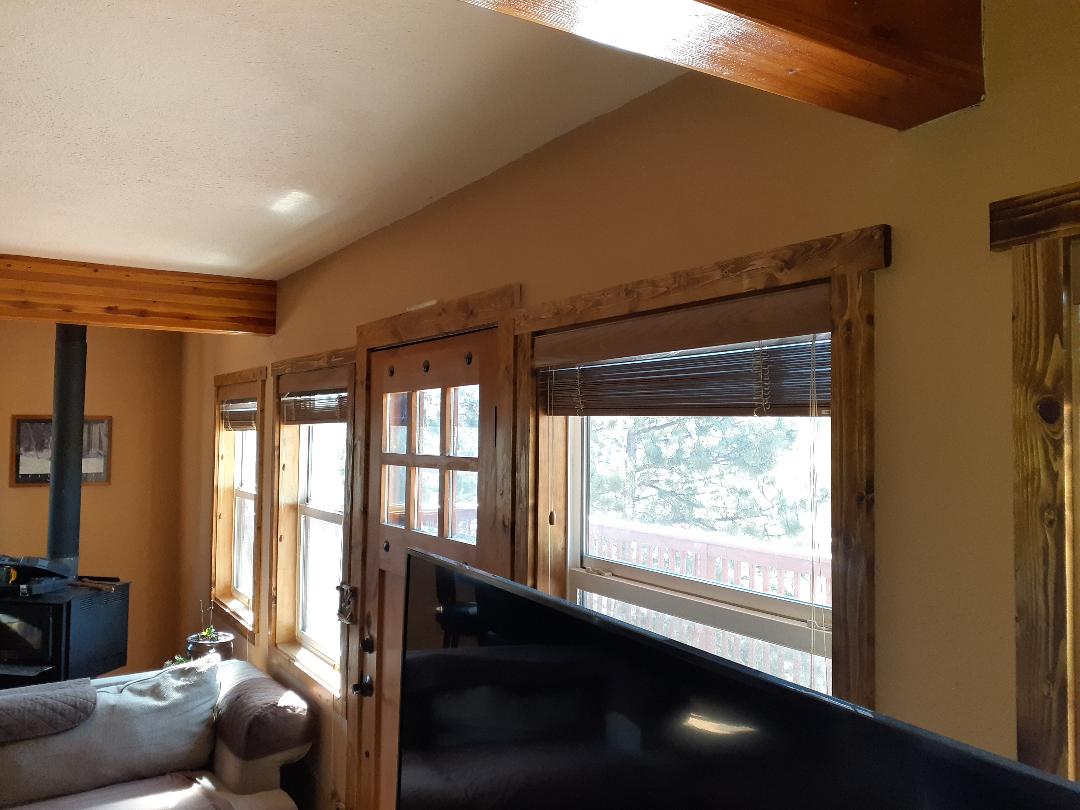 Bailey, CO. Interior of Simonton white color vinyl windows and Orepac wood entry door installed