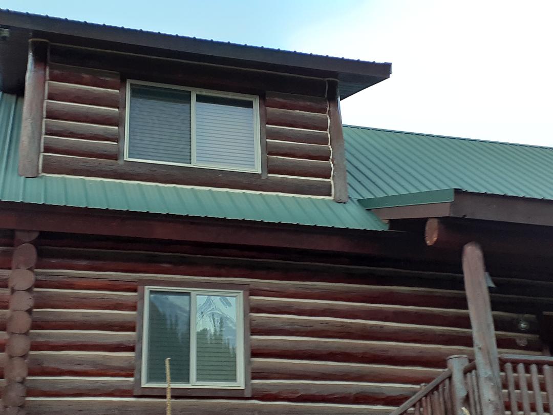 Bailey, CO. Log home with tan color Simonton vinyl windows