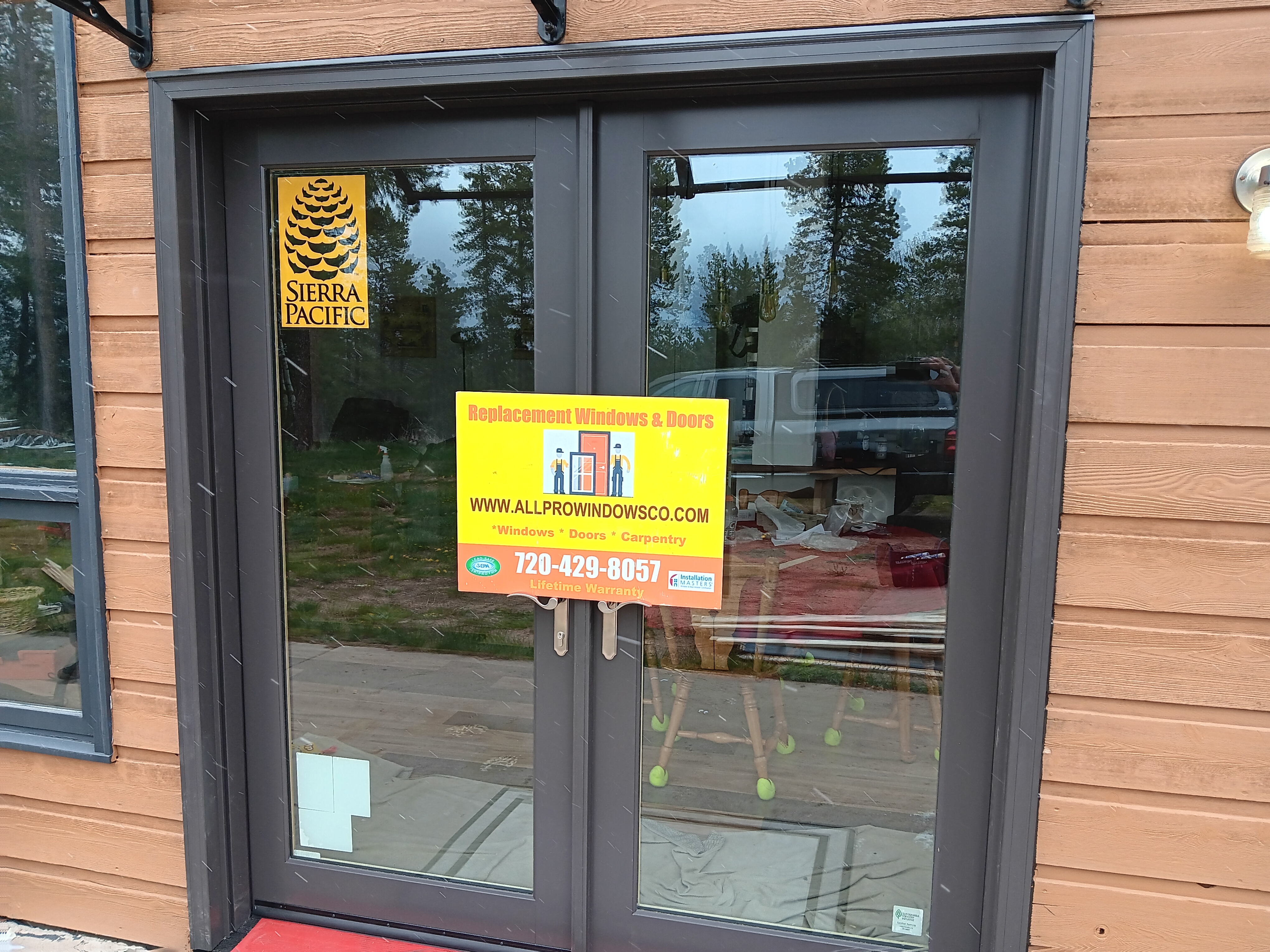 Conifer, CO. Sierra Pacific Wood-clad double inswing french door color Bronze