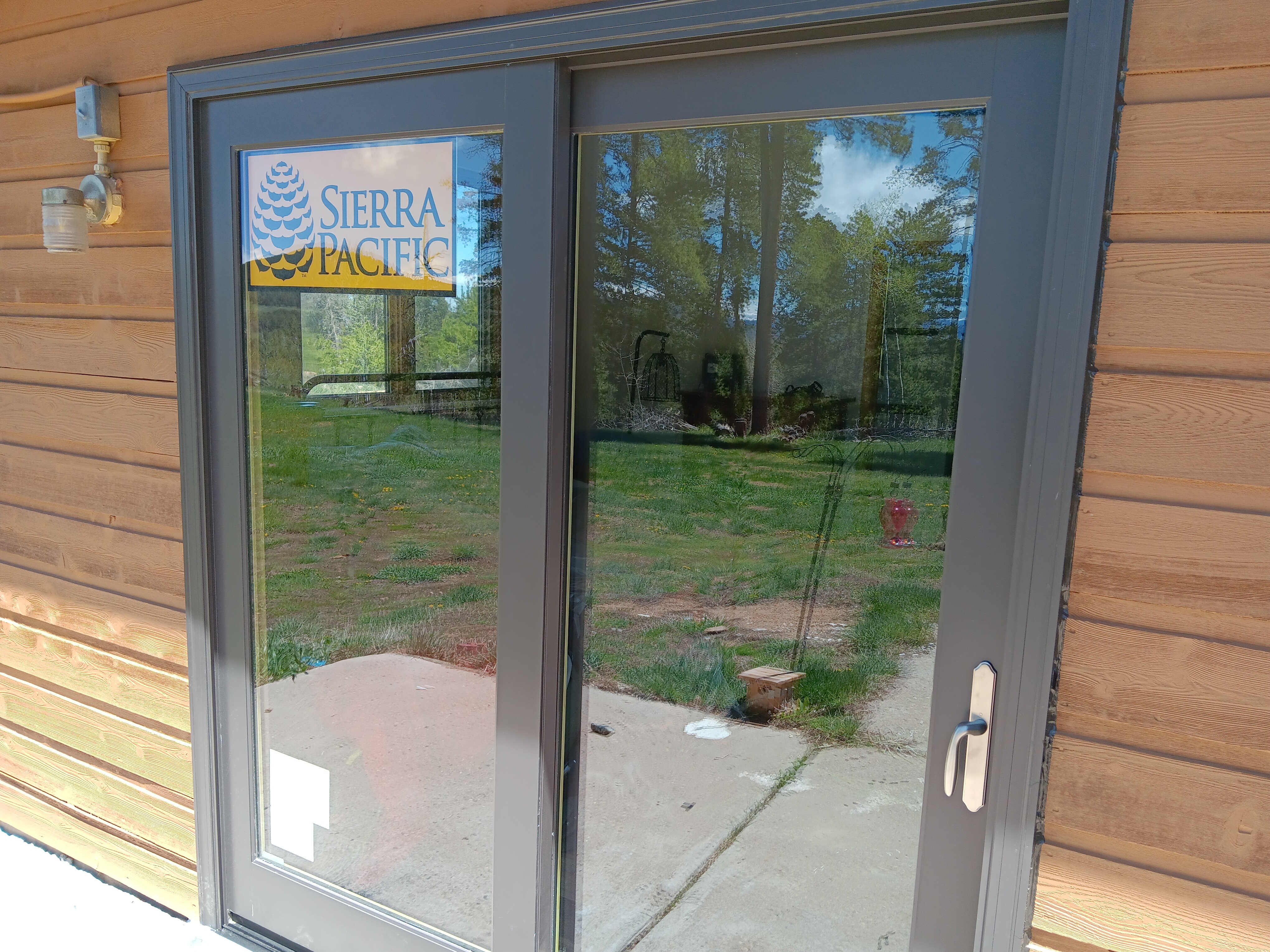 Conifer, CO. Sierra Pacific Wood-clad sliding patio door Color Bronze