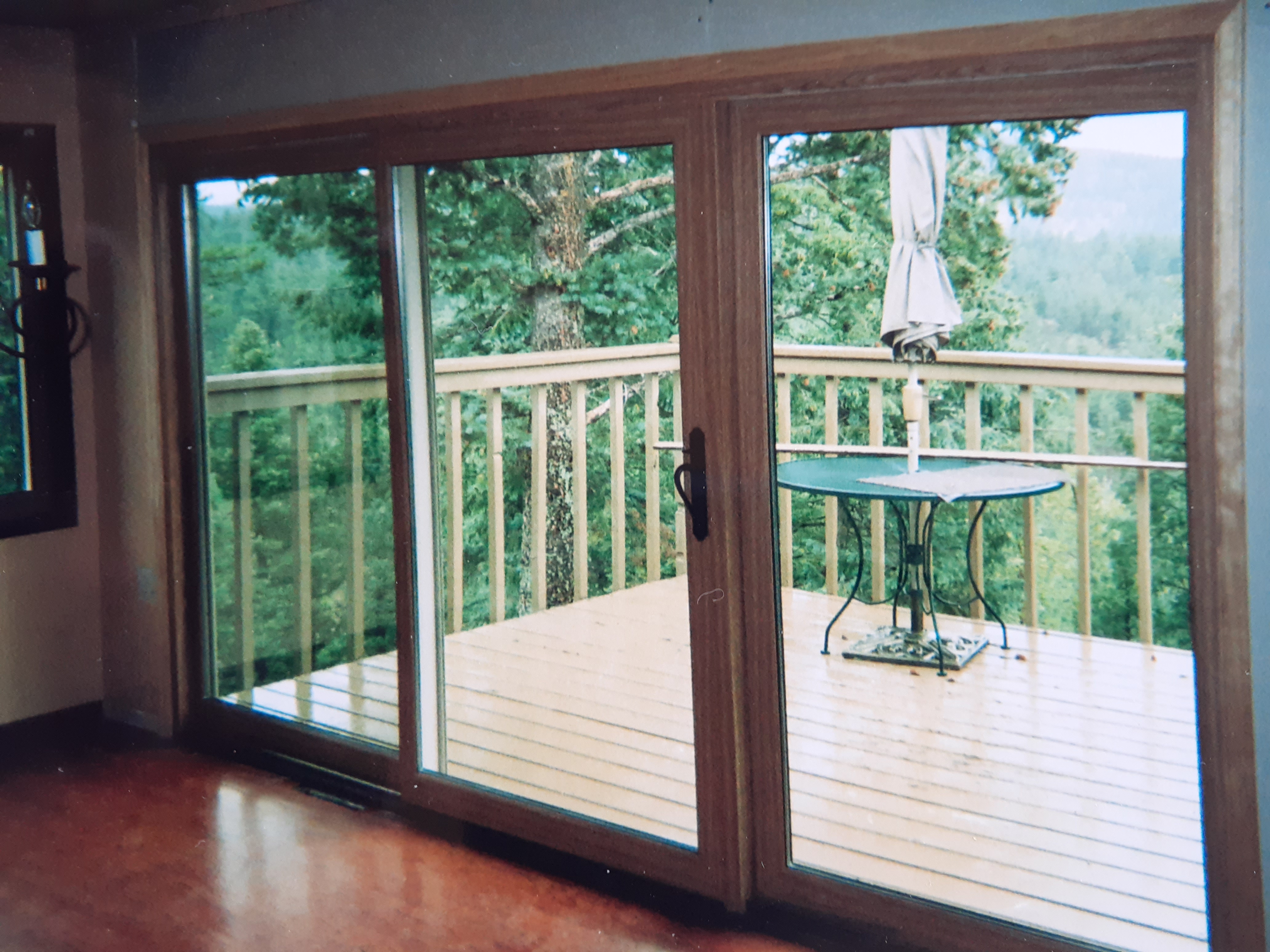 Evergreen CO. Milgard wood-clad 3 panel patio sliding door installed. Huge wow factor opening up big panoramic views