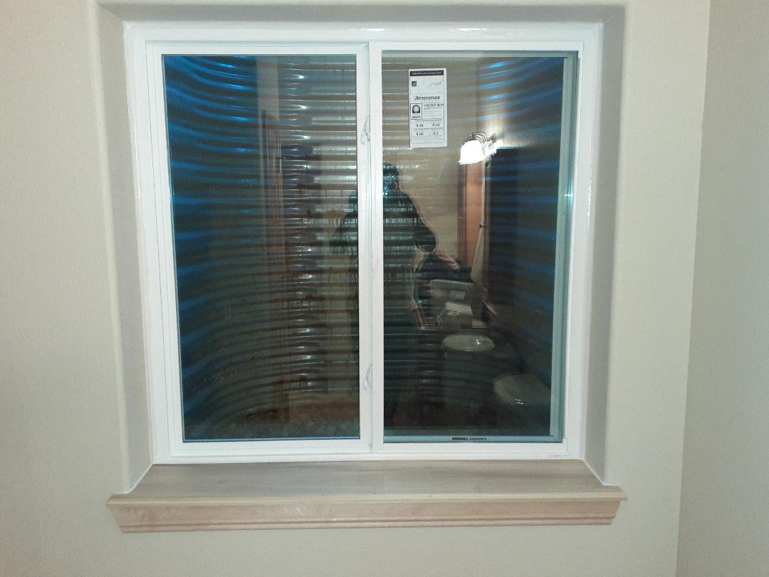 New Simonton Madeira series slider window installed with routered sill and apron. After image