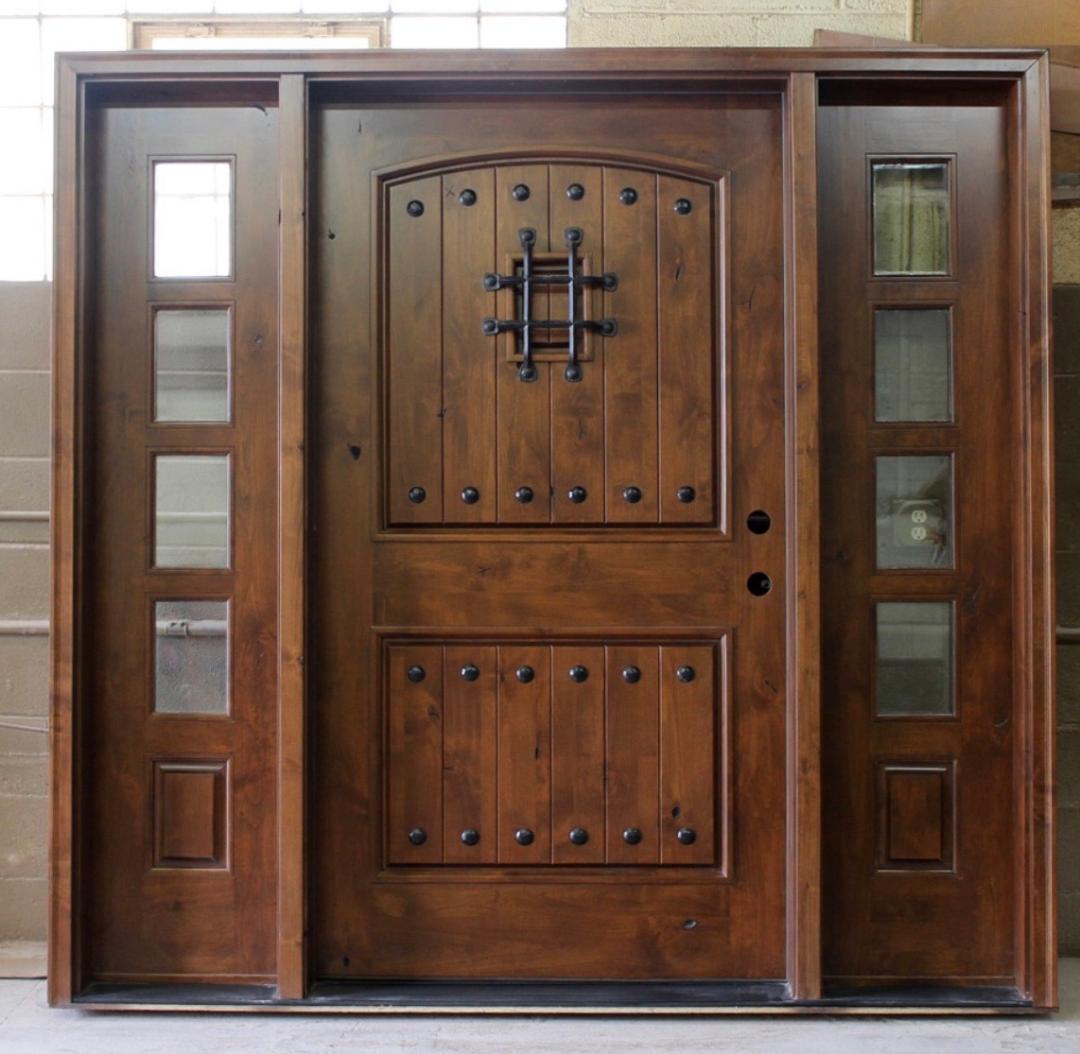 Steves & Sons (stained) Mahogany wood door with Speakeasy and clavos nails. Available as single entry door without sidelites